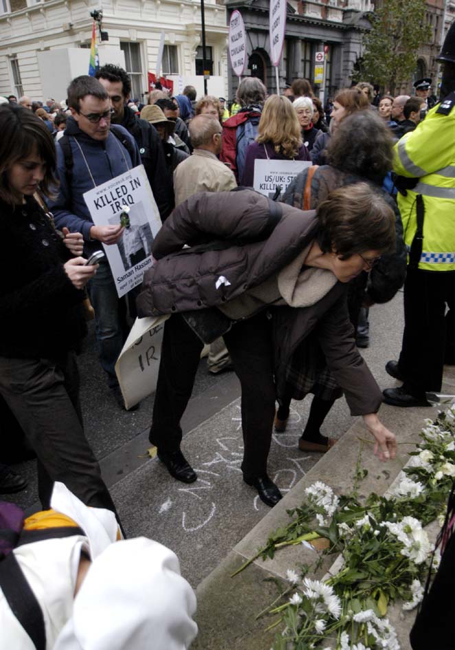 Anti war protesters lay flowers at cenotaph