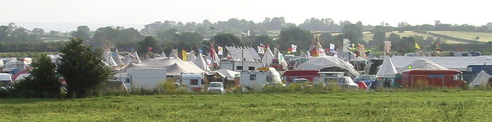 closer view - wind gennies, solar panels and tipis