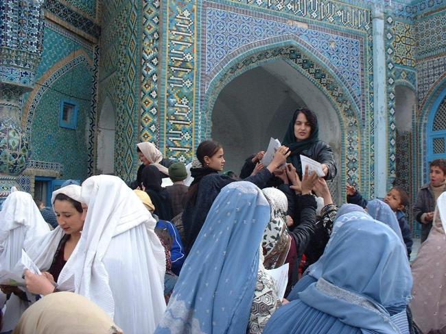 Fauzia, handing out CE leaflets, shrine, Mazar