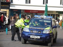 One of many police vehicles policing the giving out of cakes we assume